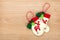 Christmas mitten decor on wooden background