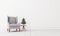 Christmas mock up interior with armchair and small Christmas tree