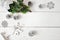 Christmas mockup on a white wooden background with snowflakes, a deer and a Christmas tree. Flat lay, top view