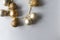 Christmas modern golden matte and glitter balls on shiny silver background with copy space, above. New Year decoration