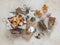 Christmas mood. Homemade edible Christmas gifts - cookies, lollipops, granola and Christmas decor on a stone light background, top