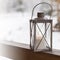 Christmas mood with outdoor candle holder and snowy background