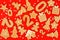 Christmas mosaic with gingerbread in the different form on traditional red background. Ginger cookies for a 2022 new year, man in