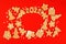 Christmas mosaic with gingerbread in the different form on traditional red background. Ginger cookies for a 2022 new year, man in