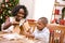 Christmas: Mother And Son Build Holiday Gingerbread House