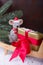 Christmas mouse with gift on wheelbarrow