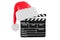 Christmas Movies concept. Ð¡clapperboard with Christmas Santa hat. 3D rendering