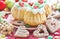 Christmas muffins, gingerbread cookies with icing hearts, colorful candies and sweets