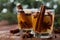 Christmas mulled apple cider with spices cinnamon, cloves, anise and honey on rustic table, traditional drink on winter holiday