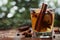 Christmas mulled apple cider with spices cinnamon, cloves, anise and honey on rustic table, traditional drink on winter holiday