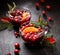 Christmas mulled wine with addition of cranberries, citrus fruits, aromatic spices and herbs in glass cups on a dark background, t