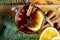 Christmas mulled wine with cinnamon, spices and orange slices on