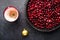 Christmas mulled wine ingredients. Lingonberry, cranberry, red berries, anise, cinnamon, orange on a dark background
