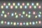 Christmas multicolored realistic garland lights on a transparent background. Glowing garland lights decoration with sparkles