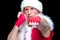 Christmas. Muscular Fighter kickbox boxing Santa Claus With Red Bandages isolated on black background.