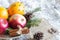 Christmas natural eco ornament with organic fruits on the snowy old table