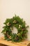 Christmas natural wreath with natural decorations - pinecones, tangerines, dried apples