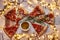 Christmas and New Year atmosphere. Hot Italian pizza with melting tomato, pepperoni and cheese on a white marbel cutting