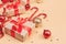 Christmas and New Year backdrop with copy space. Festively decorated  Gift boxes,  cane lollypops, christmas balls on golden