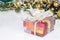 Christmas or New Year background with gift box on the background of Christmas decorations, selective focus.Preparing for a happy