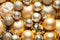 Christmas and New Year background with holiday decorations. Close up of pile golden Christmas balls,various size.