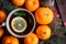 Christmas new year background with tangerines, tea with lemon. winter still. selective focus