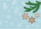 Christmas, New Year banner with gingerbread cookies on fir branches and snowflakes on a blue background