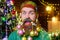 Christmas or New year barbershop. Bearded man with decorated beard with Christmas balls. Smiling bearded man with