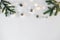 Christmas and new year composition. Christmas toys, lights or garland and spruce branches on a white background. Flat layer, top v