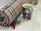 Christmas and New Year composition. Warm woolen winter blanket and Santa Claus cup of hot chocolate / cocoa.