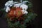 Christmas and New Year composition. Wicker basket with fir branches decorated by natural materials on dark backdrop