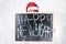 Christmas New Year concept. Model XXL in santa hat with chalkboard. Fat woman happy. Happy plus size girl hold board. Big Female