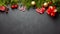Christmas or New Year dark background. Fir tree and xmas decor.