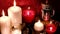 Christmas and New Year Decoration. Blurred Bokeh Holiday Background. Red candles flicker alongside. Mason Jar, Candy canes.