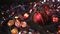 Christmas and New Year Decoration. Hanging Bauble close up. Abstract Blurred Bokeh Holiday Background. Blinking Garland