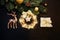 Christmas or New Year decorations on a dark background: Christmas tree, gold decorations, reindeer, garland, gift