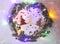 Christmas or New year festive background. Greeting card composition with green wreath, glitters, colorful lights and fir trees mad