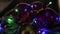 Christmas, New year, garland and Christmas balls, dark background, flashing different colors of lights