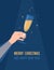 Christmas and New Year greeting card. Hand holding glass of sparkling wine or champagne on dark blue background