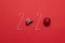 Christmas and New Year holiday 2020 inscription from various decorated objects classic red glass baubles ball, toy car on a red