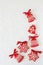 Christmas New Year holiday background, red gingerbread cookies on white table. Copy space.