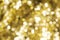 Christmas and New Year holidays blurred golden sparkles background