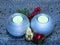 Christmas New year home decor. Two silver ball shaped candles table decoration.