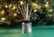 Christmas or New Year home fragrance with air freshener sticks in front of festive tree. Winter holiday aromatherapy concept