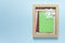 Christmas, New Year mockup template with wooden frame, white paper snowflake and colored blank cards on blue backgound