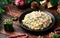 Christmas and New year Olivier salad, traditional Russian food with decoration, gifts, green tree branch on wooden