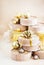 Christmas or New year round kraft gift boxes, gold holiday balls on a bokeh background of twinkling party lights of garland