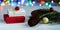 Christmas or New Year`s composition with gifts on a white background with a multi-colored boke. Selective focus