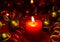 Christmas and New Year`s festive evening burning candle bokeh image.