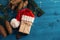 Christmas or New Year`s gift in a knitted Santa Claus hat, packed in kraft paper and tied with a twine thread